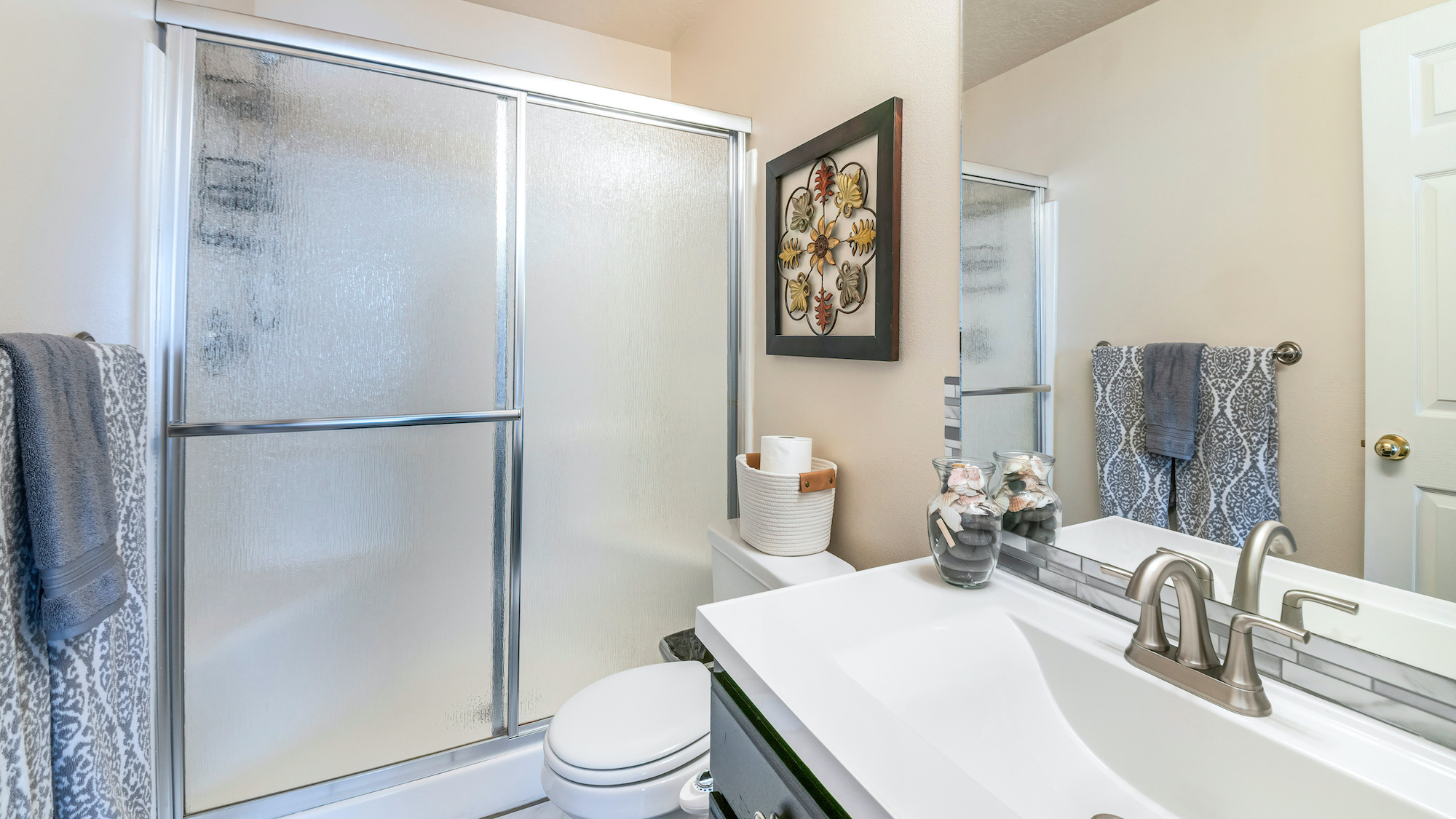 Bathroom with framed shower doors